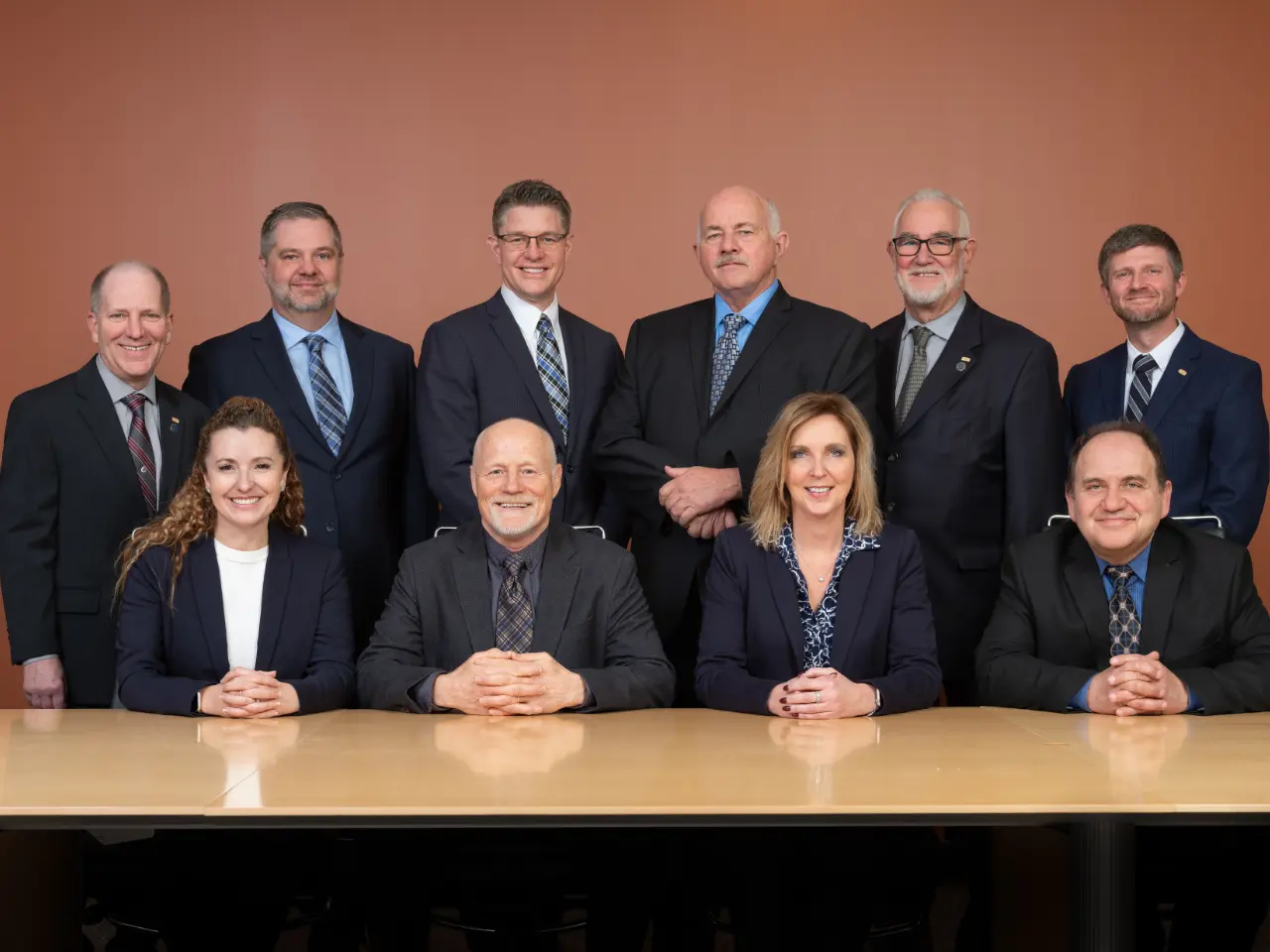 BCM Insurance's Board of Directors gathered around a boardroom table
